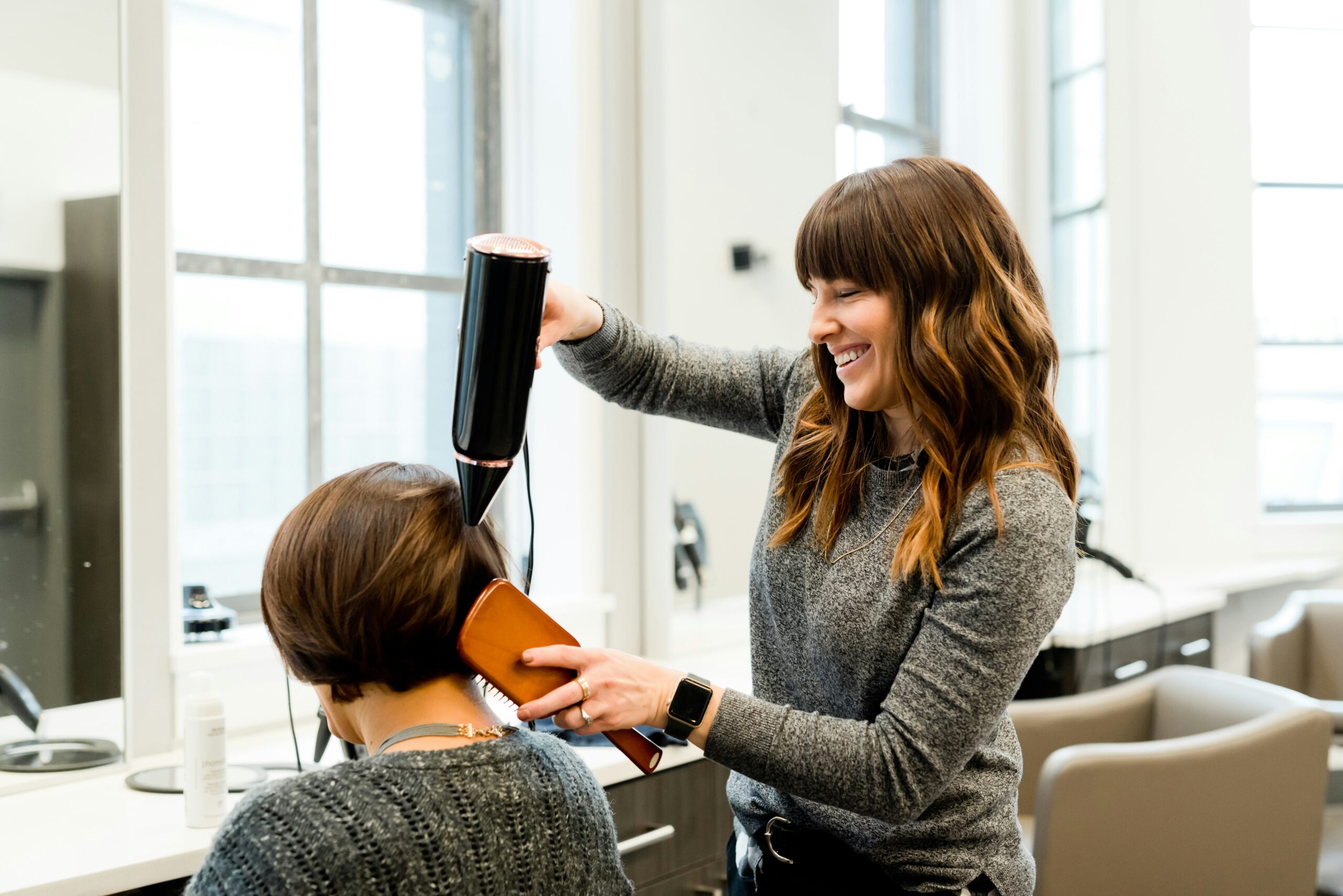 Lady getting a professional hair cut and colour at Radiance Room natural hair salon.